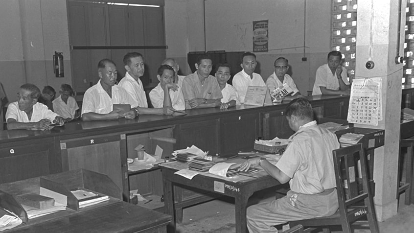 SI - Immigration Dept counter with local staff