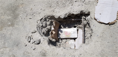 concrete cig - hole CU Duty-unpaid cigarettes found within the concrete block.