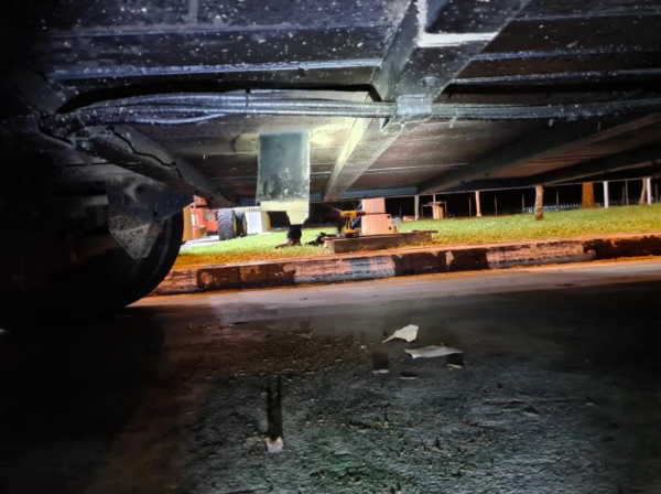 ICA officers pried open a small section below the lorry bed, revealing the duty-unpaid cigarettes hidden within it. (Photo: ICA) ICA officers pried open a small section below the lorry bed, revealing the duty-unpaid cigarettes hidden within it. (Photo: ICA)