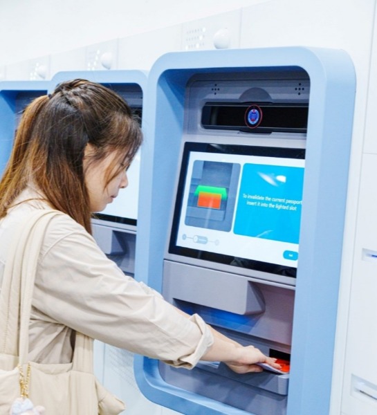 Customers with current valid document(s) insert their document(s) into the self-collection kiosk for invalidation