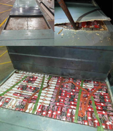 Duty-unpaid cigarettes concealed within the modified roof compartment of a container