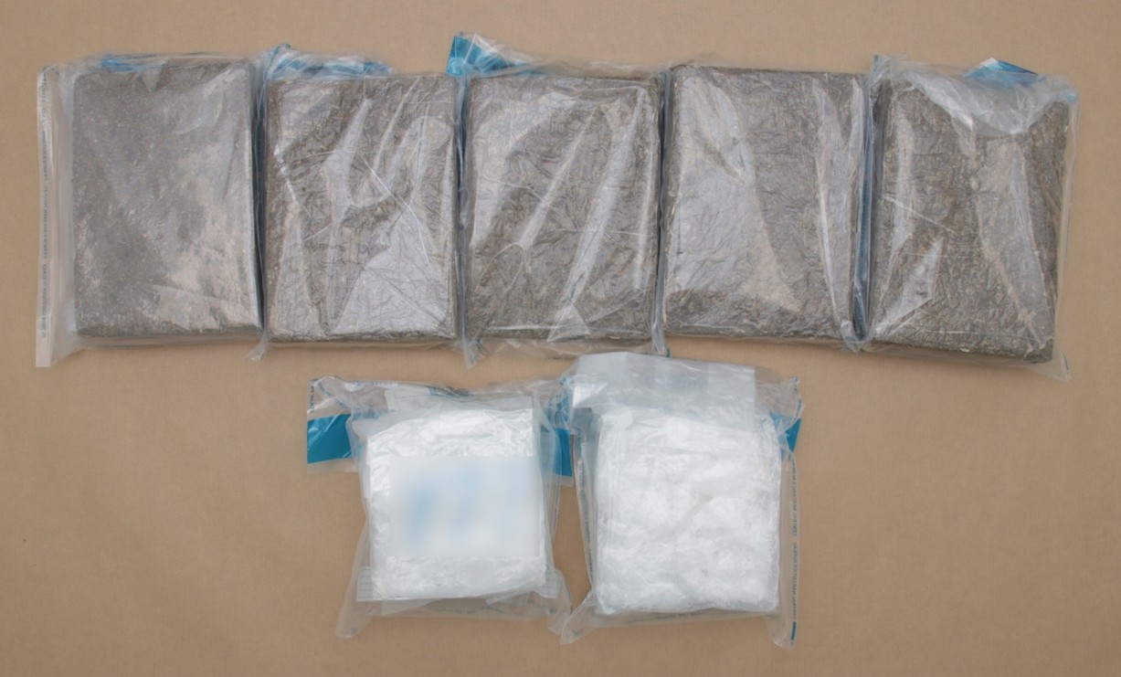 Photo (CNB): Cannabis and ‘Ice’ from the two plastic bags seized from the boot of the car driven by the 23-year-old Malaysian man.